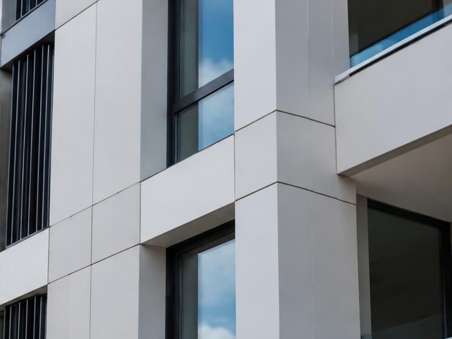 Non-combustible façade panels and window junctions