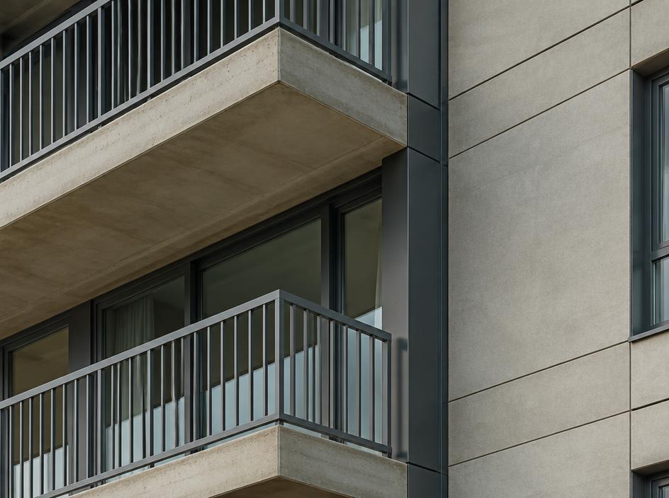 Apartment balcony and non-combustible cladding junction